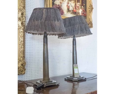 TABLE LAMPS, a pair, Art Deco in the form of military shells with Guniean fowl feathered shades, 67cm H. (2)