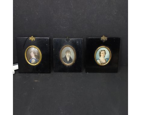 Three 19th century portrait miniatures, depicting two ladies and a gentleman, in matching ebonised frames, 7 x 5cm (3) 