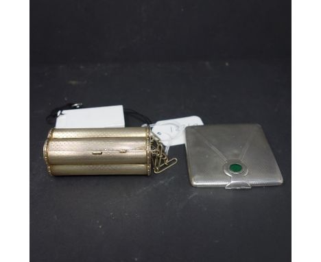 A silver gilt ladies compact of faceted cylindrical form, H.8.5cm, together with an Art Deco engine turned silver case case w