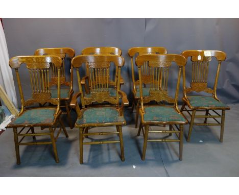 A set of 7 American style light oak dining chairs 