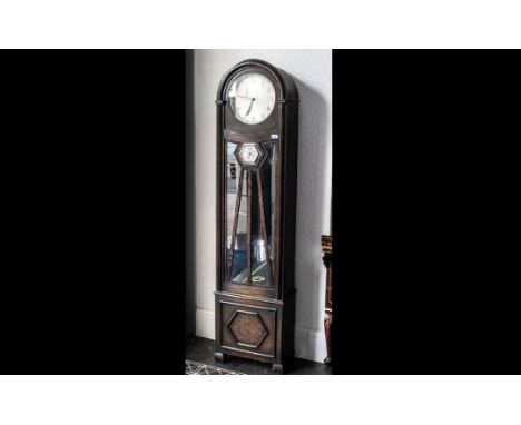 An Art Deco Long Cased Clock with silver dial, with Arabic numerals, glazed sun burst front with barometer, three weights wit