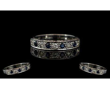 18ct White Gold Diamond and Sapphire Half Eternity Ring set with alternating round brilliant cut diamonds and sapphires. Full