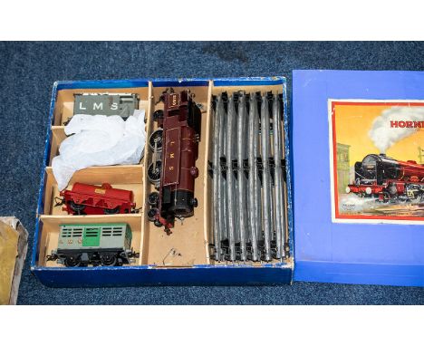 Hornby Train Set,  Gauge 0, Clockwork, in original box, LMS 180 engine and goods carriages including 'Shell', track and acces