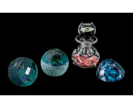 Caithness Glass Paperweights comprising blue glass weight, and two Royal Doulton Caithness Five to Midnight Guild weights No.