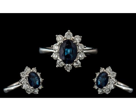 Ladies 18ct White Gold Attractive Sapphire and Diamond Set Cluster Ring. Full Hallmark to Interior of Shank. The Oval Blue Sa