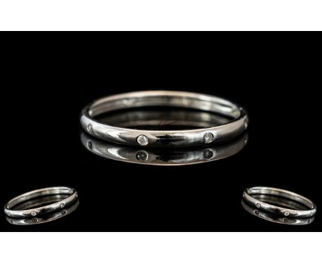 18ct White Gold Diamond Band Set With Eight Round Brilliant Cut Diamonds. Ring Size O. 