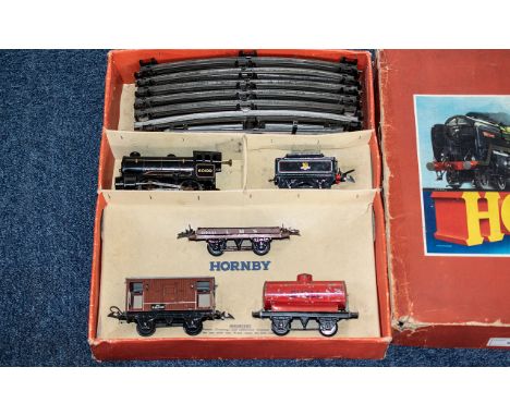 Hornby Goods Set No. 50, Gauge 0, Clockwork, in original box, engine, track and goods carriages including 'Shell'.