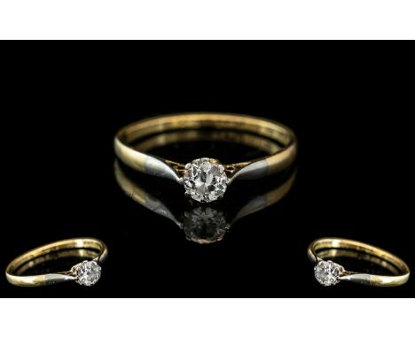 18ct Gold And Platinum Single Stone Diamond Ring, Marked 18ct and Platinum to Interior of Shank, Platinum Shoulders. The Roun