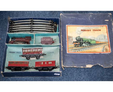 Hornby Clockwork Train Set, Gauge 0, Clockwork, in original box, engine No. 5600 and four carriages, track and key.