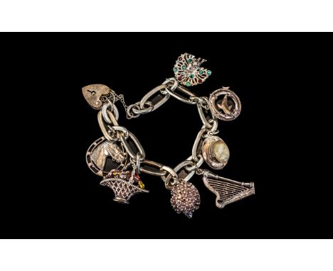 A Good Quality Vintage Sterling Silver Charm Bracelet - Loaded with 7 Good Charms, All Marked for Silver. Comprises Harp, Hed