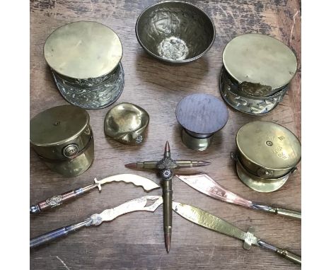 Collection of WW1 Trench Art, includes pin trays in the form of military caps, letter openers and a Cross made of inert round