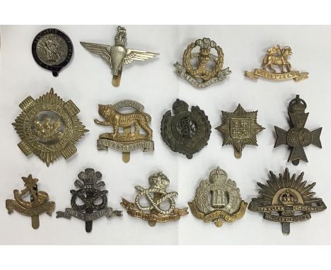 Collection of British military cap &amp; uniform badges, including post 1952 Parachute Regiment, Royal Guernsey light infantr