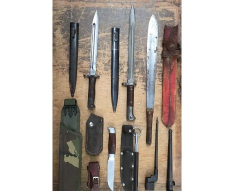 Collection of bayonets includes British WW2 spike bayonet with tapered scabbard, European bayonet sold out of service to Far 