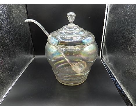 Large glass punch bowl and ladle with  iridescent finish, small chip in rim of bowl and ladle has been broken and a few chips