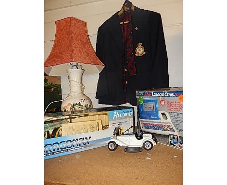 Mixed lot of sundries to include remote control helicopter, oriental style lamp, box of china dolls, RAF blazer and tie etc