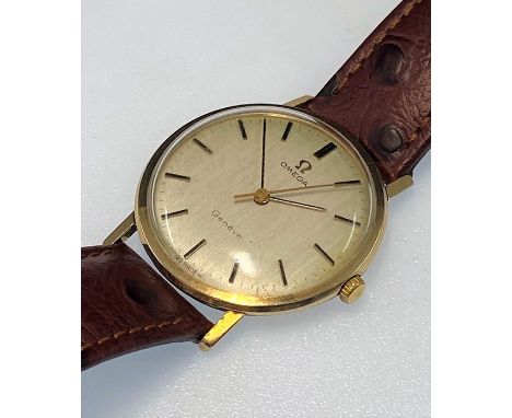 Vintage 9ct gold Omega gents wristwatch with champagne face and gold baton markers in working order but no warranty given wit