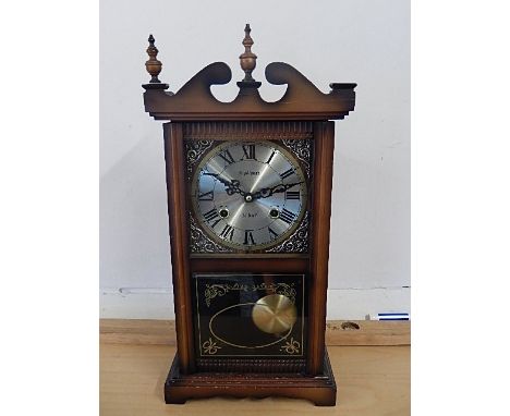 Mahogony cased 31 day modern clock, finial missing