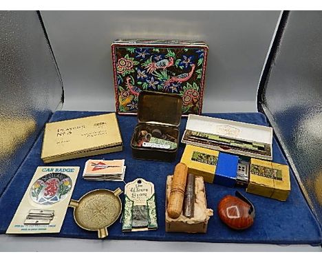 a selection of collectors items to include tins, harmonics, pocket spirit level, screwdriver, buttons, badges, cigarette card