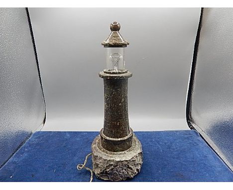 vintage cornish polished serpentine lighthouse lamp, set on unworked rock base 12" tall slight crack in glass