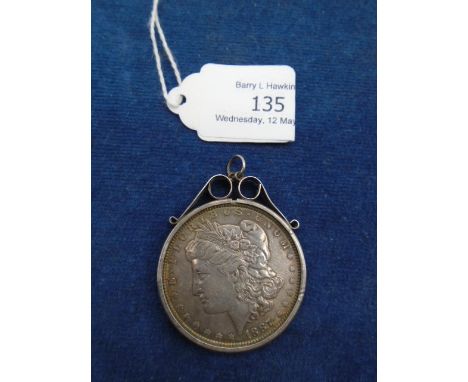 United States 1887 silver dollar in a silver pendant mount