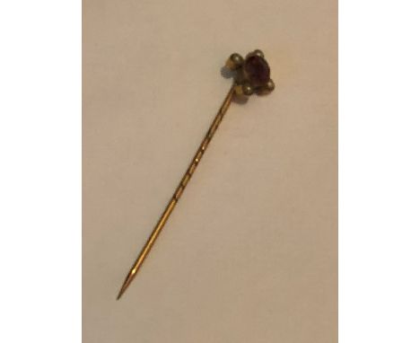 9ct stick pin with red stone