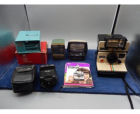 Polaroid land camera instamatic with flash unit, soligor flash gun and 3 viewers