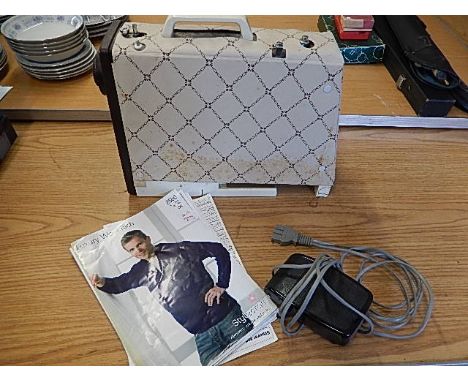 vintage Jones sewing machine with foot pedal, manual and few patterns