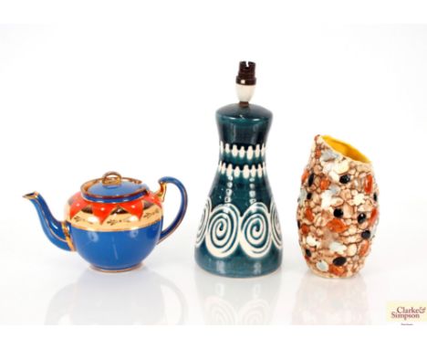 A Lotus Pottery table lamp; a Sylvac shell vase and a brightly coloured teapot