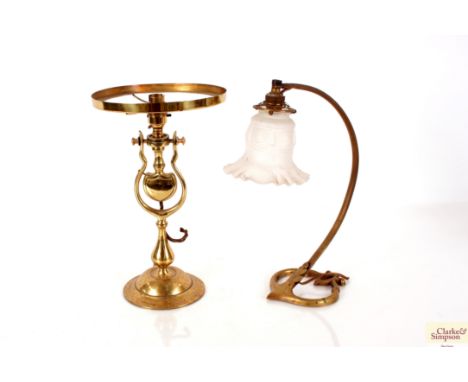 A brass Art Nouveau table lamp with frosted glass shade and another (no shade)