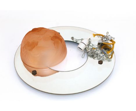 An Art Deco ceiling light, the domed pink glass shade decorated doves, set in a mirrored surround, 46cms dia. overall
