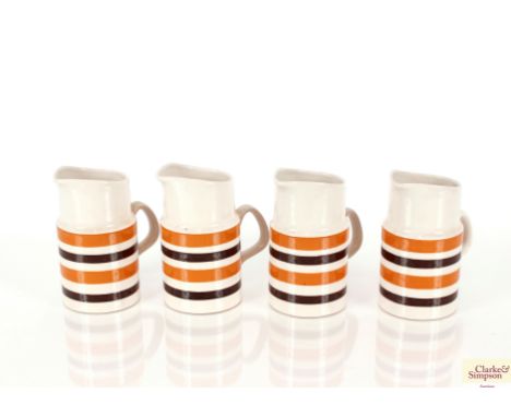 A set of four Staffordshire "Bracken" pattern jugs and three graduated Myott blue and white jugs