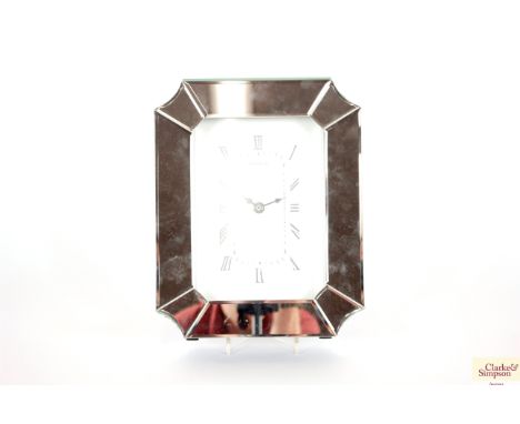 A mirrored mantel clock, 31cm x 25cm
