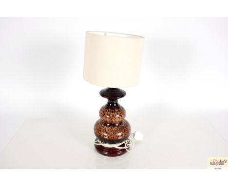 A 1970's continental pottery brown glazed table lamp with shade