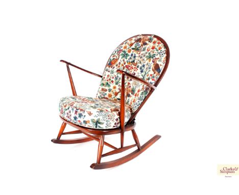 An Ercol stick back rocking chair