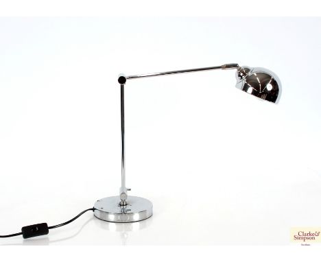 A chrome plated angle poise style lamp