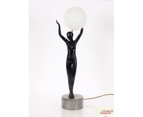 An Art Deco design table lamp, in the form of an elegant lady in evening dress holding lampshade globe aloft, 64cm dia.