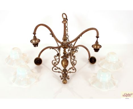 An Art Nouveau chandelier with four Vaseline glass shades