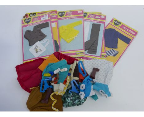 Nine Sindy Mix "n" Match fashion cloth packs together with a selection of loose vintage dolls clothes & shoes etc.  (a Lot)