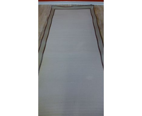 A contemporary canvas and beige woollen runner, 357 x 131cm 