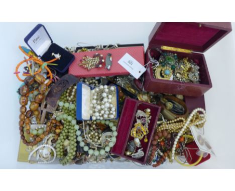 A large quantity of vintage and later costume jewellery to include beads, bangles, rings and brooches etc