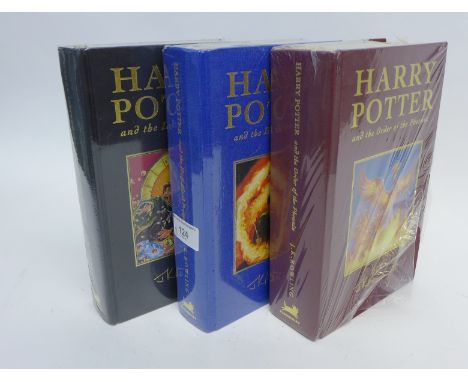 Two first edition Harry Potter hardback books;  Harry Potter and the Deadly Hallows, Harry Potter and the Half Blood Prince t