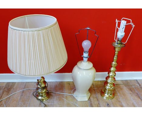 A pair of brass knop stemmed table lamps and a cream glazed baluster lamp base  (3)