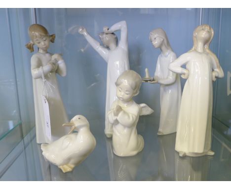 A group of six Lladro and Nao Spanish porcelain figures (6) 