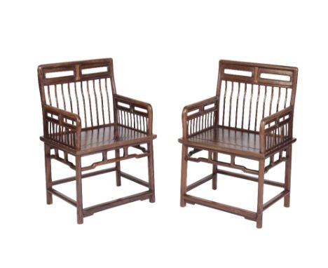 PAIR OF HUANGHUALI COMB-BACK CHAIRS, 17TH / 18TH CENTURY the fine spindle backs each flanked by conforming arm rests, over pa