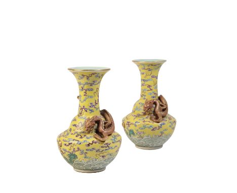 PAIR OF FAMILLE ROSE YELLOW-GROUND VASES, QIANLONG SEAL MARKS BUT 19TH CENTURY the flared necks each applied with iron-red an