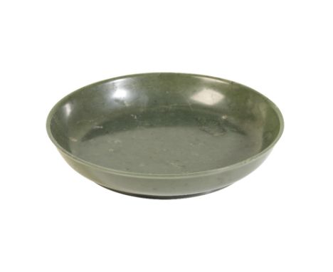 FINE SPINACH JADE LOW DISH, QIANLONG PERIOD the circular dish of generous size with rounded sides rising to a gently everted 