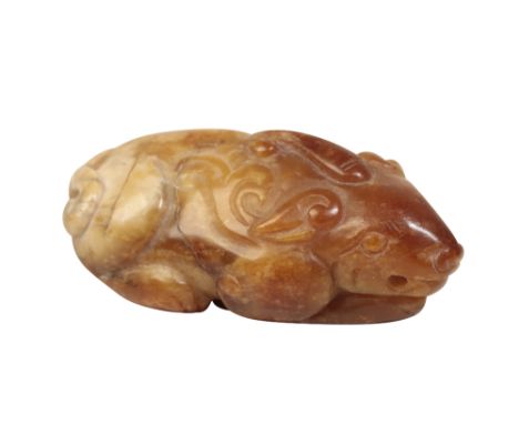 RUSSET JADE PENDANT, MING DYNASTY modelled as a recumbent mythical beast, Length: 6cm  