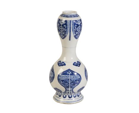 BLUE AND WHITE 'ARCHAISTIC' GARLIC MOUTH VASE, KANGXI SIX CHARACTER MARK AND OF THE PERIOD the shaped sides painted in tones 