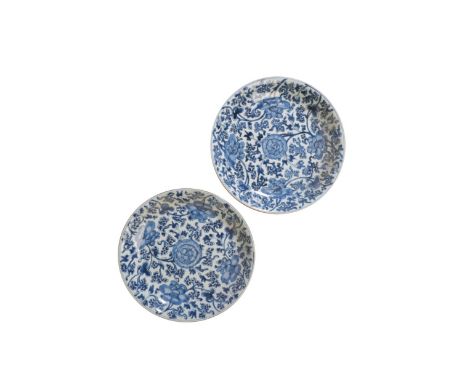 PAIR OF LARGE BLUE AND WHITE 'LOTUS' DISHES, KANGXI PERIOD painted in tones of cobalt with lotus blossom and scrolling tendri
