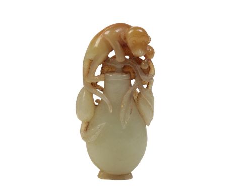 JADE 'MONKEY AND PEACH' VASE GROUP, QING DYNASTY in the form of flattened baluster vase carved with a monkey and peaches, Hei